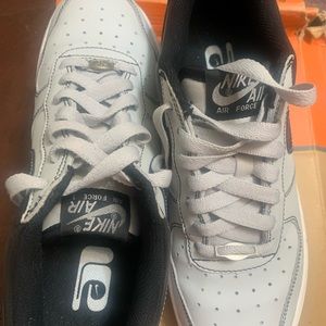 Gray and black Nike uptown’s